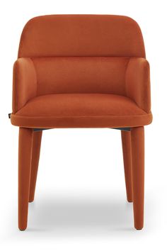 an orange chair sitting on top of a white floor