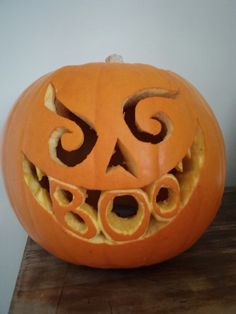 a carved pumpkin with an evil face on it