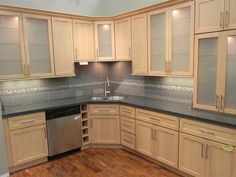 an empty kitchen with wooden cabinets and black counter tops is pictured in this advertisement for real estate