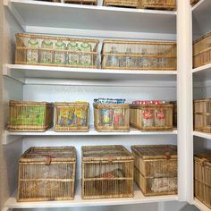 the shelves are filled with wicker baskets and food items for storage in this pantry