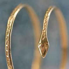 This is part of Chairish’s Fine Jewelry assortment.  Bracelet in 18 karat yellow gold.  Antique gold bangle bracelet, it represents a snake which is wound with double turn around the wrist, the top is engraved on the whole of the bracelet.  Interior circumference : 19 cm approximately, width : 4 mm approximately, thickness : 1,6 mm approximately.  Total weight of the jewel : 39,9 g approximately.  Authentic antique jewelry - Work of the 1960s.  Our opinion : flexible, this antique gold snake bracelet can be stretched or tightened according to the circumference of wrist and the desired position on it.  This item has been used and may have some minor flaws. Before purchasing, please refer to the images for the exact condition of the item.  A return request must be submitted within 48 hours a Snake Bangle Bracelet, Snake Bracelet, Gold Snake, Gold Bangle Bracelet, Gold Bangles, Antique Gold, Wrap Bracelet, Antique Jewelry, 1960s