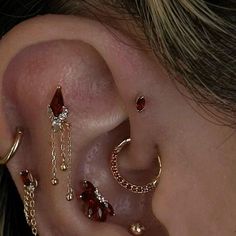 a close up of a person with ear piercings