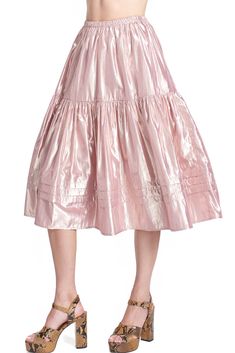 The Brita skirt is a pretty pull on midi shape. Its' a swing style and has a ruffle tier with 3 deep pleats along the bottom. Shown here in our "Metallic Pink Lady".  Content: 68% nylon / 32% metallic Color: Pink Lady Fits: Relaxed Fit, take your regular size or size down for less volume Sizes: XS-L What we Love: Pretty color not to be missed shine Limited Edition, Sewn In Los Angeles with Love Patricija is 5'9" size 2 and is wearing a size S     ~* ﻿THIS ITEM IS FINAL SALE *~    xs s m l length waist sweep Pink Lady, Metallic Pink, Weekend Style, White Party, Metallic Colors, Pretty Colours, Final Sale, Apparel Accessories, New Dress