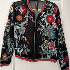 A Showstopper! Mesh Jacket With The Most Beautiful And Intrigue Design. I’m Not Sure If These Are Embroidered Or Applied, But They Are Vibrant And Beautiful. I Purchased This At A High End Boutique Store In Franklin, Tn And Never Wore It. Pit To Pit - Approx 21” Length Approx 23” Sleeve Length Approx 22” I Paid $120. Tags: Garden, Floral, Boho, Nashville, Bachelorette, Butterfly, Mesh, Unique Clothing, Unique Jacket Fall Outerwear With Multicolor Embroidery And Floral Print, Fall Floral Print Outerwear With Multicolor Embroidery, Fall Multicolor Embroidered Floral Outerwear, Fall Floral Print Multicolor Embroidered Outerwear, Spring Black Outerwear With Floral Embroidery, Multicolor Floral Embroidered Spring Outerwear, Spring Multicolor Floral Embroidered Outerwear, Fall Multicolor Outerwear With Floral Embroidery, Embroidered Multicolor Outerwear For Spring