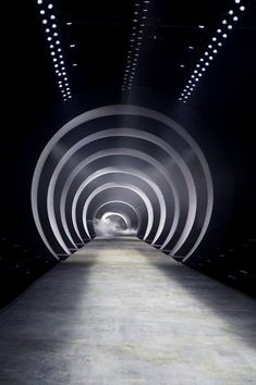 an empty tunnel with light at the end