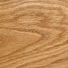 closeup of the grain on a wooden surface with natural light brown woodgrain