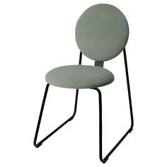 a green chair with black legs and a round seat on the back, in front of a white background