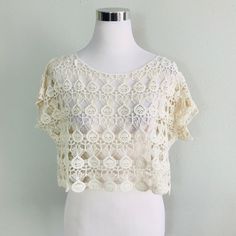 Short Sleeve Top Features A Scoop Neckline, Crochet Material, Boxy Fit And Scalloped Hem. (Undershirt Not Included) Fabric Content: 100% Cotton Size Scale: S/M - M/L Description: L: 14" B: " W: 21". Firm Price Summer Crochet Top With Crochet Trim, Summer Crochet Trim Short Sleeve Top, Short Sleeve Open Knit Crochet Top, Lace Crochet Open Knit Top With Short Sleeves, Lace Crochet Top With Short Sleeves, Summer Lace Tops With Open Knit, Beige Crochet Top With Open Knit Short Sleeve, Summer Lace Top With Open Knit, Summer Lace Open Knit Tops