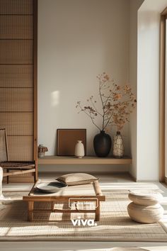 a living room filled with lots of furniture next to a wall mounted vase and window