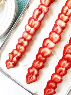 strawberries are arranged on top of the cake