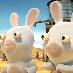 two animated rabbits standing next to each other in front of an industrial area with buildings