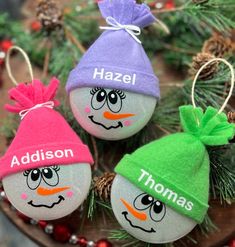 three personalized christmas ornaments with faces on them