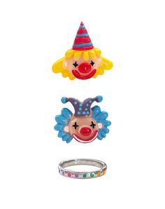 three rings with clown faces on them and one ring in the shape of a face