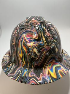 a multicolored hat sitting on top of a white table