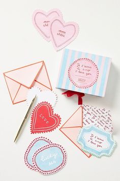 valentine's day cards and envelopes on a table