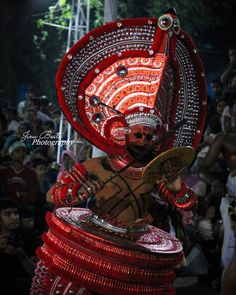 a man dressed in an elaborately decorated costume