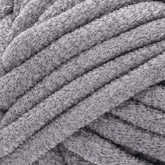 a close up view of a gray knitted material