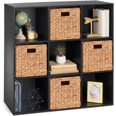 a book shelf with four baskets and books on the top one is filled with books