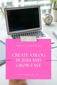 a laptop computer sitting on top of a desk next to a pink sign that says create a blog in 2012 and grow fast