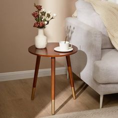 a living room with a white couch and coffee table