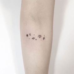 a woman's leg with stars and hearts on the left side of her arm