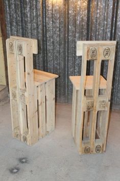 two wooden chairs sitting next to each other