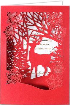 a red card with an image of a deer and snowflakes