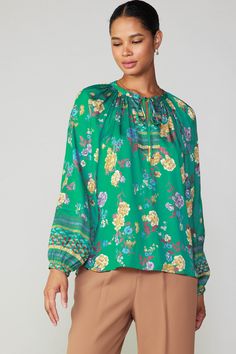 This split-neck blouse has a loose, flowing fit in a charming floral motif accented by an intricate border print. Tie up the neckline or leave it loose for a more casual feel. •Split neckline with self-tie •Gathered detailing •Long sleeves •Slim button cuffs •Relaxed fit item number 2330147 Border Print, Green Blouse, Fit In, Floral Motif, Item Number, Split, Long Sleeves, Relaxed Fit, Long Sleeve