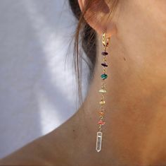 "These huggie style duster earrings feature strands of rainbow gemstones- one stone for each of the 7 chakras. From bottom to top, strand includes pink tourmaline, carnelian, citrine, peridot, turquoise, lapis lazuli and amethyst. The bottom of the earrings are finished with one sparkling clear crystal quartz point. Huggie hoops are 0.5 inch and earrings hang about 4.5 inches in total. ~Why to wear chakra gemstone jewelry~ Chakra jewelry that is made with the earth's natural gemstones is known t Gold And Crystal Earrings, Gifts With Crystals, Crystal Huggie Hoop Earrings, Crystal Healing Jewelry, Beaded Crystal Earrings, Earrings Aesthetic Simple, Crystal Jewelry Aesthetic, Diy Crystal Earrings, Crystal Earrings Diy