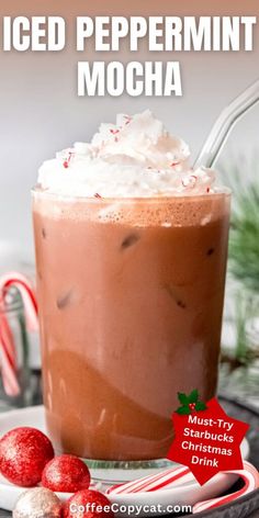 iced peppermint mocha in a glass with whipped cream and candy canes