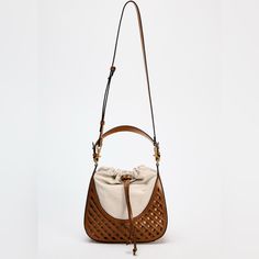 Nwt Zara Contrasting Bucket Bag Bucket Bag In A Combination Of Materials. Handle And Two Adjustable And Removable Crossbody Straps. Drawstring Closure. Height X Length X Width: 9.1 X 9.8 X 2.8 Inches (23 X 25 X 7 Cm) Color: Dark Tan. Luxury Beige Pouch Hobo Bag, Luxury Beige Hobo Bag For Errands, Leather Bags With Braided Handles In Neutral Color, Neutral Leather Bag With Braided Handles, Cream Pouch Bag With Leather Handles, Zara Bucket Shoulder Bag, Neutral Leather Shoulder Bag With Braided Handles, Everyday Cream Hobo Bag With Gold-tone Hardware, Cream Hobo Bag With Gold-tone Hardware