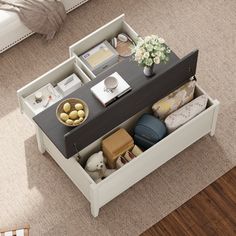 a coffee table with drawers is shown in this aerial view from the top down on carpeted flooring