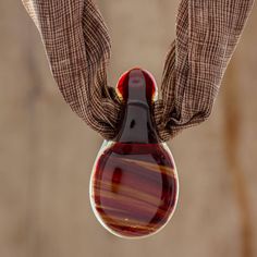 Costa Rican artisan Gerty Schlager reclaims scraps of stained glass and fuses it to create artful jewelry designs. In this handcrafted necklace a teardrop art glass pendant in warm earthy reds and yellows suspends from a silk scarf in a brown and ivory print. The necklace is finished with brown cord that can be tied to the desired length. The artisan advises storing the necklace flat so as not to wrinkle the silk. Women Suits Wedding, Scarf Necklace, Costa Rican, Imperial Glass, Glass Pendant Necklace, Handcrafted Necklace, Women Artisans, Jewelry Packaging, Traditional Techniques