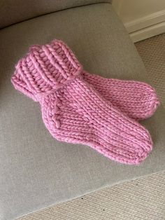 The Super Chunky Cosy Sock is a Pdf knitting pattern that knits up a pair of lovely thick, warm socks. Knitted in stockinette stitch in the round from the toe up, ending with a folded-down rib cuff. They can be made oversized to create a slipper sock and worn over a thinner pair of socks (my favourite way to wear them!) for extra cosy feet. Happy knitting! Cozy Knitted Socks, Cozy Chunky Knit Socks, Cozy Chunky Knit Socks With Round Toe, Cozy Pink Knitting Pattern, Cozy Knitted Yarn Socks, Cozy Hand Knitted Socks, Cozy Snug Hand Knitted Pattern, Cozy Hand Knitted Yarn Socks, Cozy Handmade Pink Knitting Pattern