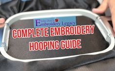 the complete embroidery hooping guide is in someone's hand, holding it up