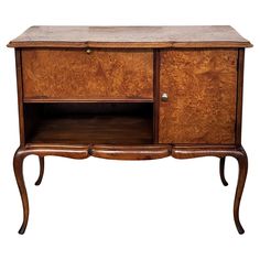 an old fashioned wooden cabinet with marble top