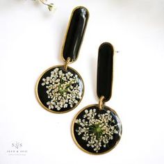 Artistic Black Dangle Earrings, Unique Flower-shaped Resin Earrings, Artsy Black Earrings With Ear Wire, Artsy Black Dangle Earrings, Artsy Black Drop Earrings, Artistic Black Nickel-free Earrings, Black Artsy Drop Earrings, Artistic Black Enamel Jewelry, Handmade Black Enamel Earrings