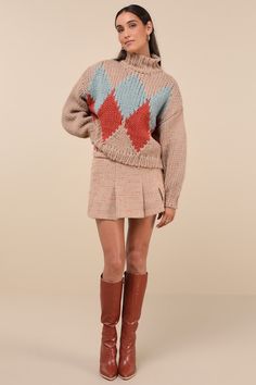 As the snow falls, cozy up in the Little Lies Cabin Cuteness Taupe Multi Diamond Pattern Pullover Sweater! Chunky, cotton-blend knit shapes a darling, multicolored diamond pattern, framed by long sleeves with drop shoulders and fitted cuffs. Relaxed bodice has a mock neckline and a lightly cropped hem. Ribbed knit at neckline, cuffs, and hem. Fit: This garment fits true to size. Length: Size small/medium measures 21" from shoulder to hem. Bust: Great for any cup size. Waist: Not Fitted - comfortable room throughout midsection. Undergarments: May be worn with any standard bra. Fabric: Fabric is very stretchy. Unlined. 65% Cotton, 35% Viscose. Cold Water Wash With Similar Colours. Do Not Bleach. Dry Cleanable. Do Not Tumble Dry. Imported. Lulus | Cabin Cuteness Taupe Multi Diamond Pattern Pu Cozy Long Sleeve Argyle Sweater, Cozy Argyle Pattern Long Sleeve Sweater, Winter Cotton Argyle Sweater, Winter Argyle Knit Sweater, Winter Argyle Pattern Tops, Knit Sweater With Argyle Pattern And Long Sleeves, Snow Falls, Sweater Chunky, Mock Neckline