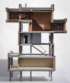 a cardboard model of a house with stairs