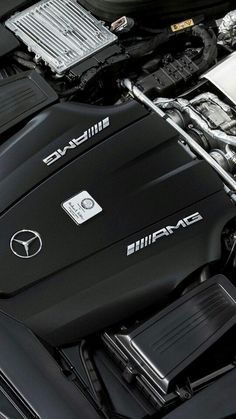 the engine of a car is shown in this close up view, with its hood open