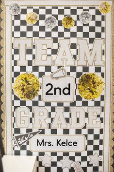 a poster with the words team 2nd grade written in black and white, surrounded by yellow flowers