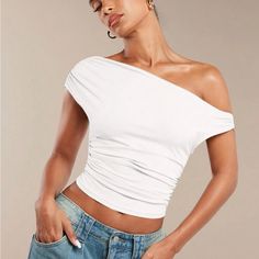 Super Cute And Stylish Ships In 5-10 Business Days Chic Ruched Off-shoulder Top For Spring, Trendy Fitted One Shoulder Top With Ruched Detail, Trendy Fitted One-shoulder Top With Ruched Detail, Ruched One-shoulder Top For Summer, Casual Ruched One Shoulder Top, Casual Fitted One-shoulder Top With Ruched Detail, Summer Tops With Ruched Asymmetrical Neckline, One Shoulder Ruched Top For Spring, Ruched Tops With Asymmetrical Neckline For Summer