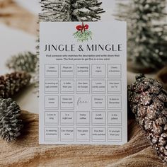 a table plan with pine cones and evergreens around it on a wooden board that says jungle & mingle