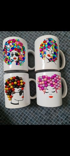 four coffee mugs with different colored beads on them and one has a woman's face painted on it