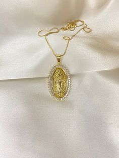 The pendant of the Virgin Mary, known as La Virgencita, symbolizes faith, maternal protection, and divine grace, making the necklace a cherished emblem of spirituality and devotion 18k gold plated stainless steel safe to be worn in water packaged in a pouch(gift ready) Gold Virgin Mary Pendant Necklace, Virgin Mary Necklace Gold, Virgencita Necklace, Gold Virgin Mary Necklace, Mary Necklace Gold, Guadalupe Necklace, Mary Necklace, Virgin Mary Necklace, Divine Grace