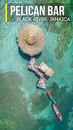 an aerial view of two boats in the water near a pier and rock outcropping