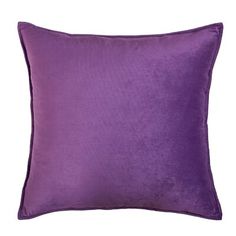 a purple pillow on a white background