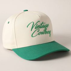 Vintage Cowboy Embroidery Two-Tone Baseball Cap - "Vintage Cowboy" Text Embroidery - 5 Panel Canvas Baseball Cap - 100% Cotton - Adjustable Buckle Closure - Embroidered In USA *One Size Fits All - Adjustable Strap Makes Fit Comfortable.* The VANTAGE Two-Tone Embroidery Trucker Hat blends style and functionality with its distinctive design. The hat features a two-tone color scheme, combining a vibrant or contrasting color on the front panels with a complementary. The embroidered detailing on the Vintage Snapback Hat With Letter Print And Curved Brim, Vintage White Snapback Hat With Letter Print, Vintage White Trucker Hat For Baseball Season, Retro Snapback Hat With Embroidered Logo For Baseball Season, Vintage Baseball Cap With Letter Print, Vintage Snapback Hat With Letter Print, Vintage Trucker Hat With Letter Print And Curved Brim, Retro Trucker Hat With Embroidered Logo And Curved Bill, Vintage White Trucker Hat With Letter Print