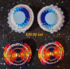 Circular beaded earrings with lever back studs. I have one in multi blue Second set is in fire colours (orange,yellow,red/blue/gold with silver trim (studded back) Blue Beaded Earrings Native American, Multicolor Bead Cap Drop Earrings, Beaded Round Clip-on Earrings, Multicolor Drop Earrings With Bead Caps, Multicolor Clip-on Round Earrings, Multicolor Round Clip-on Earrings, Multicolor Round Clip-on Earrings For Party, Party Earrings With Colorful Beads In Round Shape, Native Beading