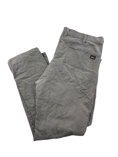 Dickies Canvas Workwear Relaxed Fit Carpenter Pants Size 40 Gray MEASUREMENTS Size is based off measurements not the tagged size. Please refer to measurements. SIZE - 40 WAIST FLAT - 20" (measurement is multiplied by 2 to get the size) RISE - 15" INSEAM - 32" LEG OPENING - 9" Please note that due to the nature of pre-owned clothing; the size mentioned in the title may not be an accurate representation of the item's fit in accordance with modern sizing guides. Referring to the measurements will h Gray Full-length Bottoms With Welt Pockets, Gray Tapered Leg Cotton Work Pants, Relaxed Fit Work Trousers With No Pockets, Gray Cotton Straight Leg Bottoms, Gray Straight Leg Cotton Pants, Stretch Cotton Cargo Pants With Belt Loops, High Waist Cotton Work Pants With Pockets, Fitted Cotton Work Pants With Pockets, Stretch Full-length Chinos With Pockets